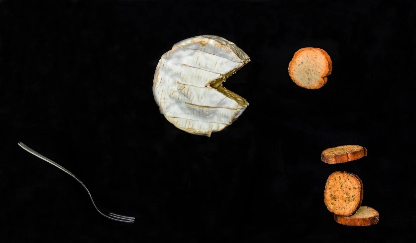 a piece of cheese with a bite taken out of it, a still life, by Etienne Delessert, unsplash, figuration libre, black backdrop!, anthropomorphic edible piechart, with bread in the slots, view from above