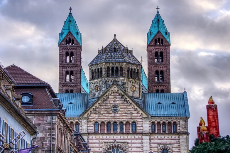 a large building with a clock on the front of it, a colorized photo, inspired by Rainer Maria Latzke, romanesque, with great domes and arches, 2 4 mm iso 8 0 0, copper, looking threatening