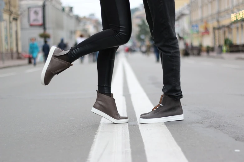 a person standing in the middle of a street, by Maksimilijan Vanka, tumblr, happening, leather shoes, happy couple, close up to a skinny, browns and whites