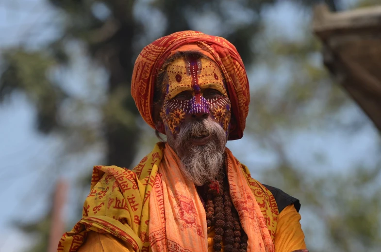 a close up of a person wearing a turban, samikshavad, jester, tribal masks, an oldman, symmetrical painted face