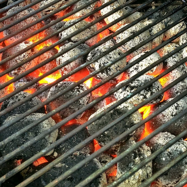 a close up of a grill with hot coals, a photo, by Loren Munk, vibrant shading, free, accurate details, lattice