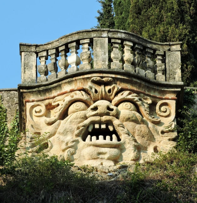 a face carved into the side of a building, an art deco sculpture, by Carlo Carlone, baroque, evil crazy laugh, in the hillside, ancient roman style, gate to hell