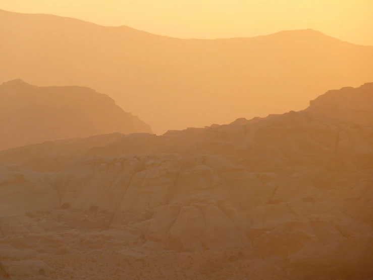 a horse that is standing in the dirt, a matte painting, by Andrei Kolkoutine, tonalism, wadi rum, sunset panorama, seen from far away, layers of strata