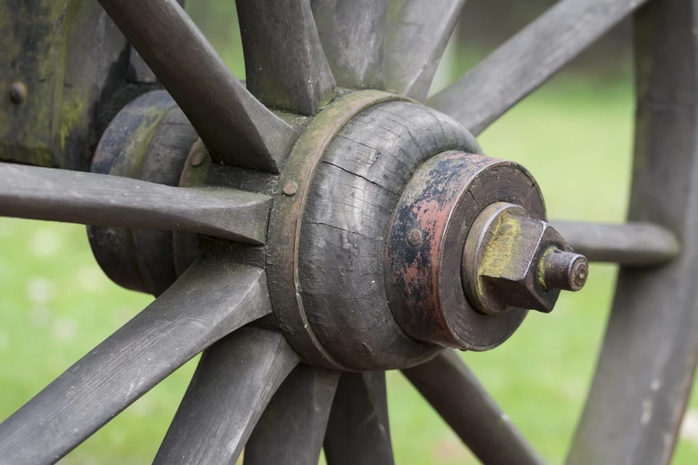 a close up of a wooden wagon wheel, a macro photograph, shutterstock, medieval weapon, stock photo, high details photo