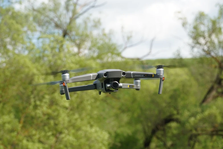 a close up of a flying object with trees in the background, pexels, uav, accurate and detailed, modern technology, profile close-up view