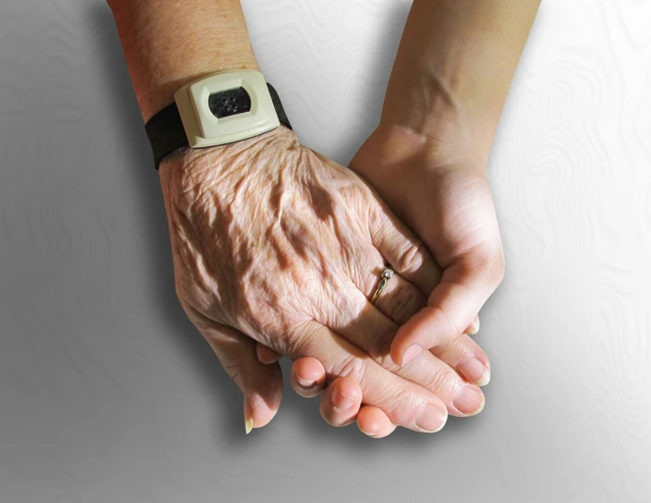 a close up of a person holding an older person's hand, a digital rendering, by Kazimierz Wojniakowski, pixabay, on a gray background, watch photo, woman holding another woman, old and young