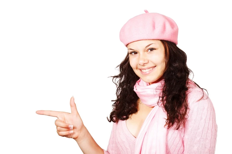 a woman in a pink hat and scarf pointing at something, istockphoto, french girl, (pink colors), pink shirt