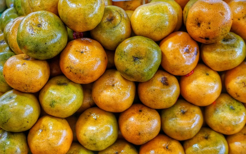 a pile of oranges sitting on top of each other, a stock photo, mingei, detiled, peruvian, version 3, 💣 💥