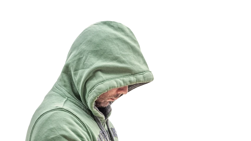 a man in a green hoodie using a cell phone, by Adam Marczyński, pixabay, digital art, shy looking down, cloak. extremely high details, real life photo of a syrian man, stock photo