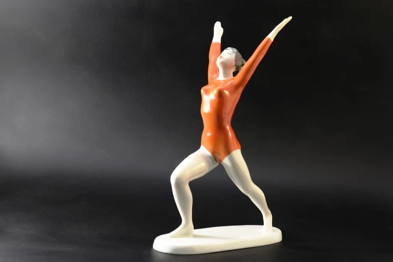 a statue of a woman in an orange leo leo leo leo leo leo leo leo leo leo leo leo leo leo leo leo leo leo leo leo, an art deco sculpture, by Ladrönn, ballet pose, thin porcelain, thumbnail