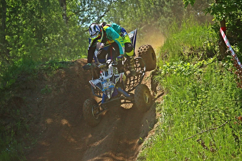 a person riding a dirt bike down a hill, a photo, all terrain vehicle race, in stvle of greg rutkowski, dlsr photo, benjamin vnuk