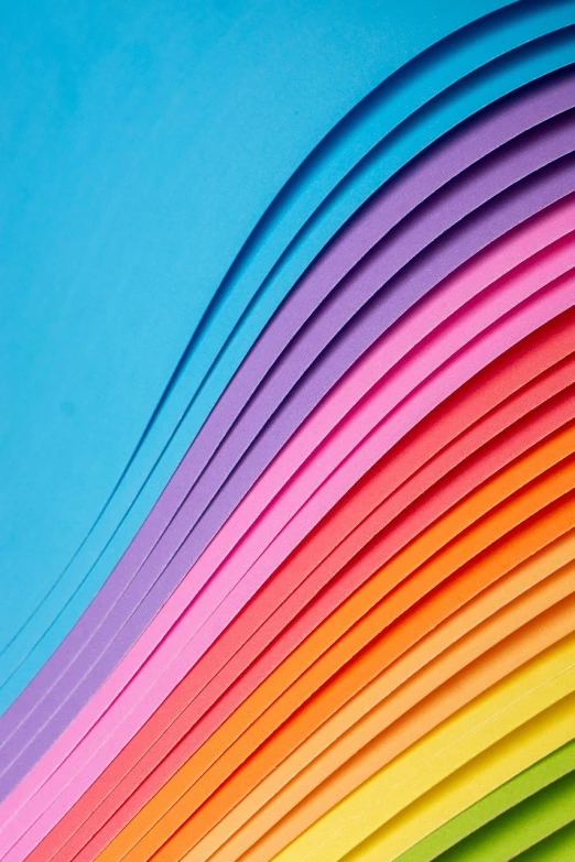 a rainbow colored wave of paper against a blue sky, by Jan Rustem, trending on shutterstock, color field, color ( sony a 7 r iv, layers of colorful reflections, vibrant color details, shades of pink and blue