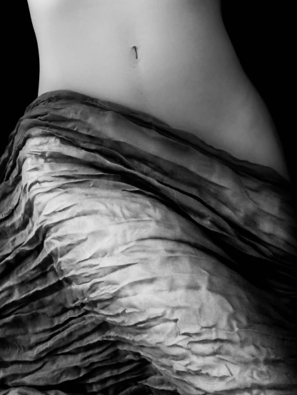 a black and white photo of a woman's stomach, a black and white photo, inspired by Edward Weston, flickr, cloth wraps, marble!! (eos 5ds r, transparent skin, ruffled fabric