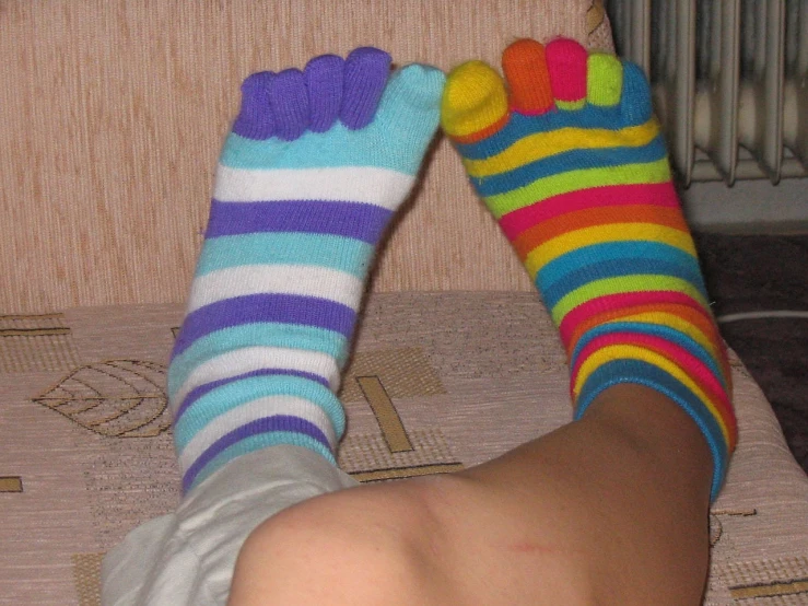 a close up of a person's feet with colorful socks, inspired by Lisa Frank, flickr, 2007 blog, 2 arms and 2 legs!, siberia!!, cute girl