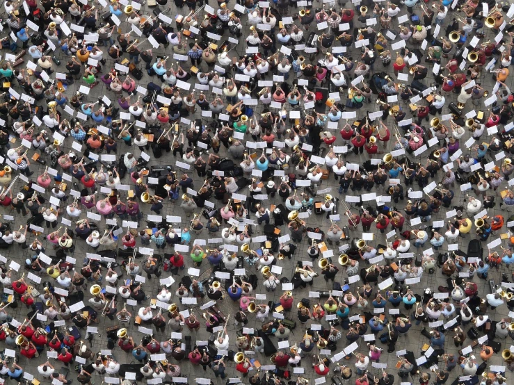 a large group of people holding up signs, by Erwin Bowien, conceptual art, band playing instruments, view from above, reuters, munich