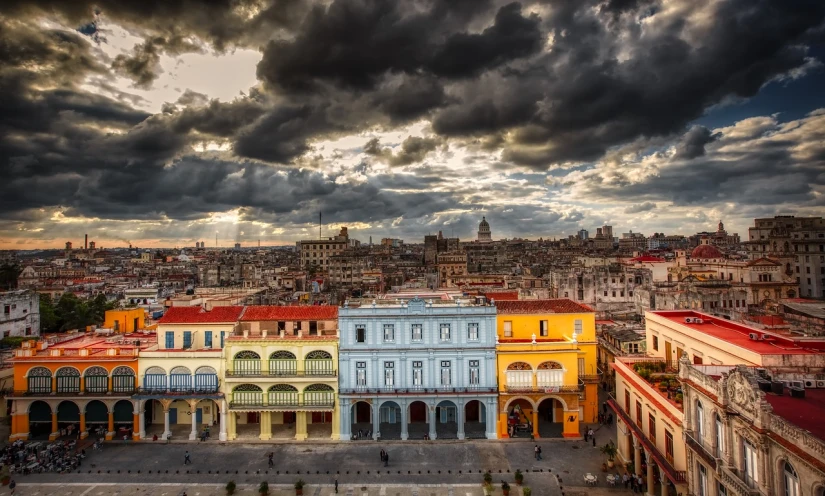 a view of a city from the top of a building, by Niklaus Manuel, pexels contest winner, baroque, cuban setting, against a stormy sky, amazing color photograph, hd —h 1024