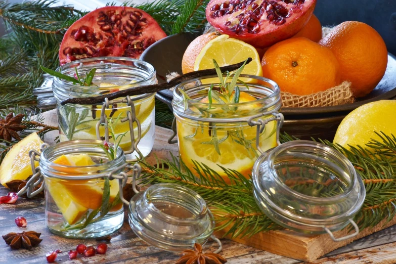 a table topped with jars filled with lemons and oranges, by Anna Katharina Block, pexels, winter vibrancy, herbs, 🦩🪐🐞👩🏻🦳, multi - layer