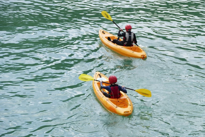 two people in kayaks paddling in the water, a photo, by Sigmund Freudenberger, shutterstock, figuration libre, one small boat, stock photo, pittsburgh, 1/30