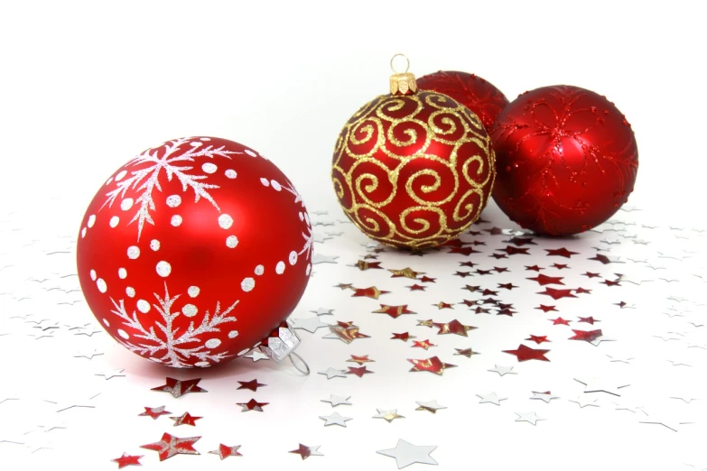 three red and gold christmas ornaments on a white surface, a photo, pixabay, glittering stars scattered about, spheres, 64x64, boys