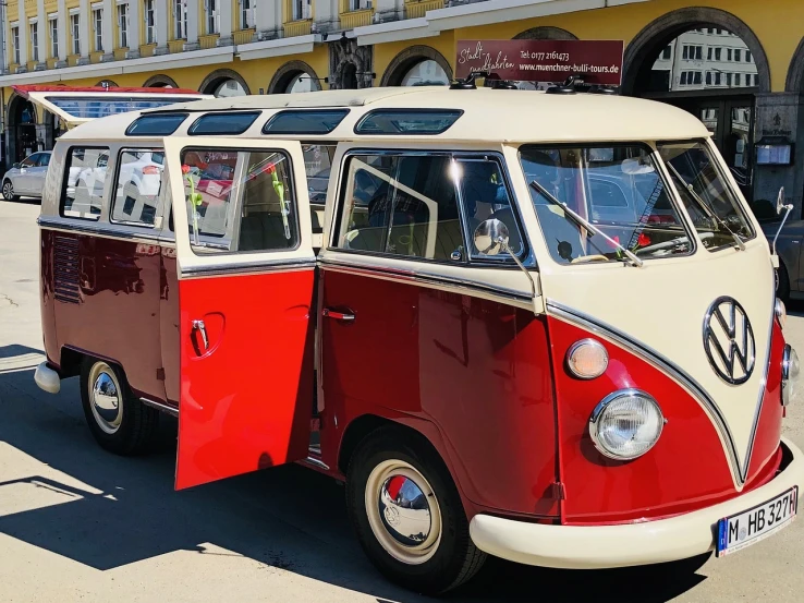 a red and white vw bus parked in front of a building, 🕹️ 😎 🔫 🤖 🚬, beautiful sunny day, vintage cars, in moscow centre