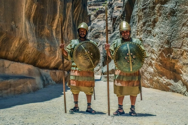 a couple of men standing next to each other, by Alexander Fedosav, pexels contest winner, dau-al-set, greek amazon warrior, canyon, shields, orthodox