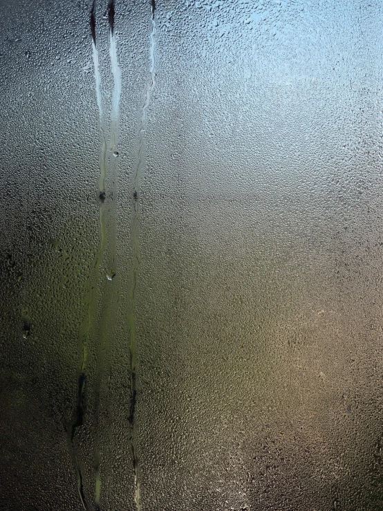 a close up of a window with water on it, a picture, lyrical abstraction, moist foggy, difraction from back light, year 2447, scratched metal