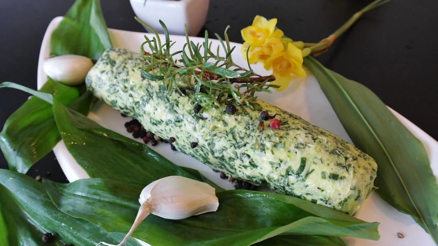 a close up of a vegetable roll on a plate, inspired by Géza Dósa, hurufiyya, flowers and foliage, herb, egg, lush green