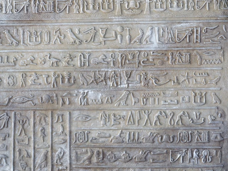 a close up of a stone with writing on it, egyptian art, by Viktor de Jeney, pexels, hieroglyphs on wall, 62 x 47 inches, symmetrical detail, high detailed close up of