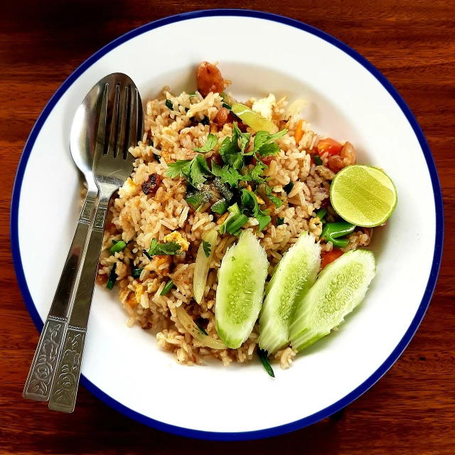 a close up of a plate of food with a fork, a picture, by Tom Wänerstrand, pixabay, dau-al-set, thai, rice, high res, 💣 💥