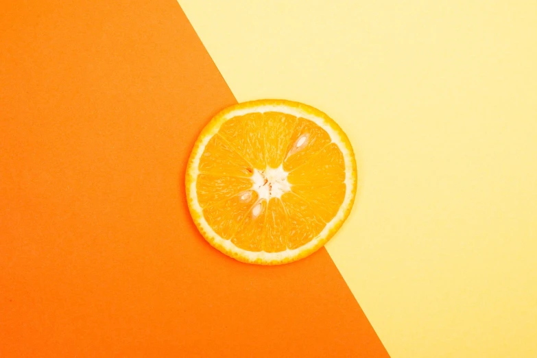 an orange cut in half on a yellow and orange background, trending on unsplash, postminimalism, 🦩🪐🐞👩🏻🦳, golden ratio!!, 🐿🍸🍋, vibrant patterns