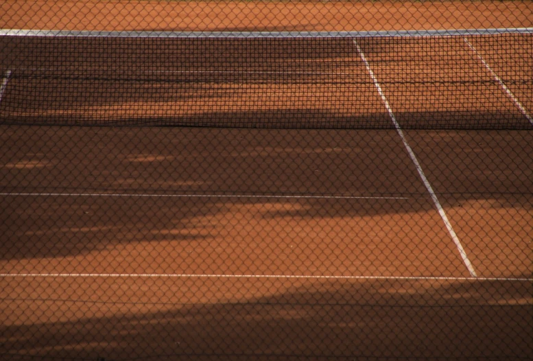 a man standing on a tennis court holding a racquet, shutterstock, net art, clay texture, evening sunlight, banner, brown