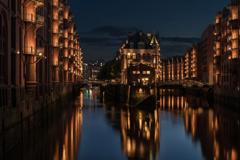 a canal in the middle of a city at night, a photo, by Harald Giersing, wooden houses, elegant bridges between towers, summer light, rolf klep