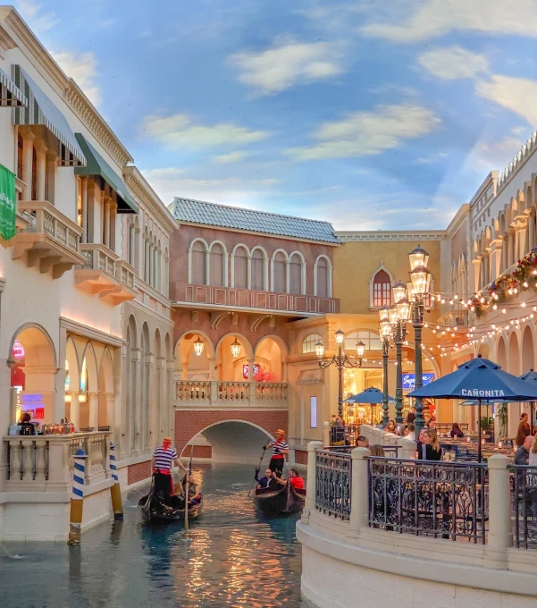 a canal filled with lots of people riding gondolas, a picture, renaissance, well lit night in las vegas, in magnificent shopping mall, morning golden hour, neo classical architecture