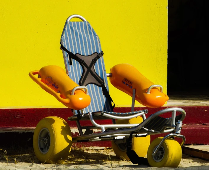 a child's tricycle with a surfboard on the back, by Richard Carline, shutterstock, fine art, yellow awning, prosthetic limbs, closeup photo, stock photo
