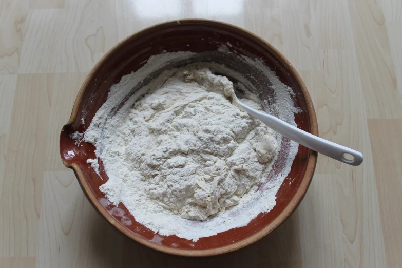 a bowl filled with flour on top of a wooden table, inspired by Slava Raškaj, flickr, process art, -step 50, gorget, thick lining, hemp