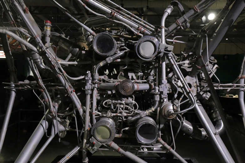 a close up of a machine inside of a building, by Robert Jacobsen, flickr, bauhaus, tubes fused with the body, hyperrealistic n- 4, jet engines, taken in 2 0 2 0