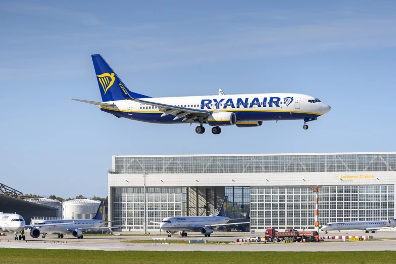 a large passenger jet taking off from an airport runway, a picture, by Richard Carline, renaissance, boeing 737 cabin, european, iralki nadar, air is being pushed around him