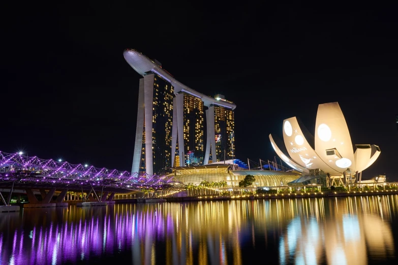 the lights on the buildings are reflecting in the water, a picture, by Patrick Ching, shutterstock, sleek curves, tourism, 2 4 mm iso 8 0 0 color, legendary masterpiece