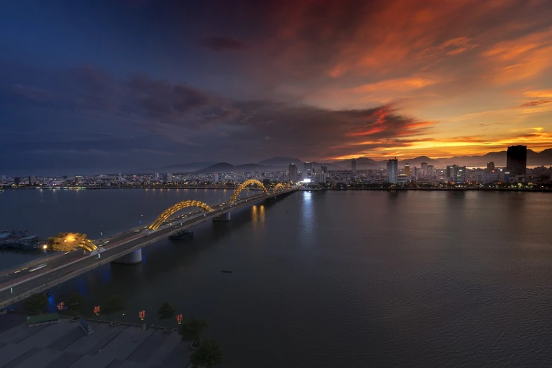 a bridge over a large body of water, a picture, pexels contest winner, happening, city sunset night, hoang lap, wide shot!!!!!!, f2.8 50mm