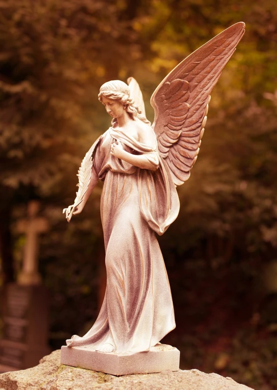 a statue of an angel holding a cross, a statue, by Marie Angel, shutterstock, big white glowing wings, graceful and elegant, grave, 3 / 4 view of woman with wings