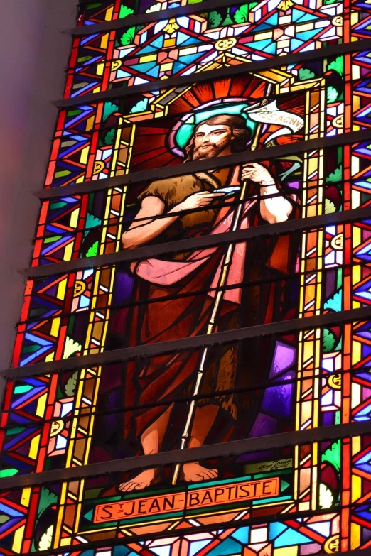 a stained glass window with a picture of jesus holding a staff, a photo, high res photo, high details photo, full of colors and rich detail, in this church interior