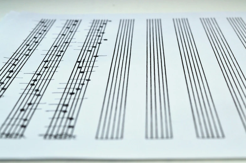 a sheet of music sitting on top of a table, by Alison Watt, flickr, analytical art, lined up horizontally, technical drawings, in a row, set against a white background