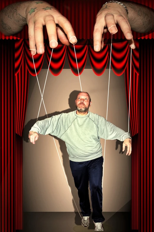 a man holding on to strings while standing in front of a curtain, by Jon Coffelt, flickr, shock art, big hands, paul giamatti, [ realistic photo ]!!, dan harmon