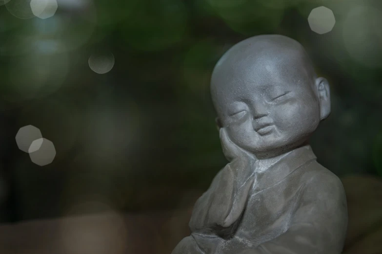 a close up of a statue of a person, a statue, inspired by Kaigetsudō Ando, concrete art, gentle bokeh, child, asleep, song nan li