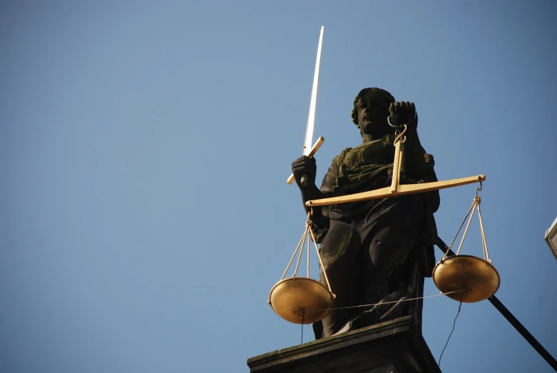 a statue of a lady justice holding a sword, a statue, by Daniel Ljunggren, flickr, looking from slightly below, zdzisław, foam, joseph todorovitch ”