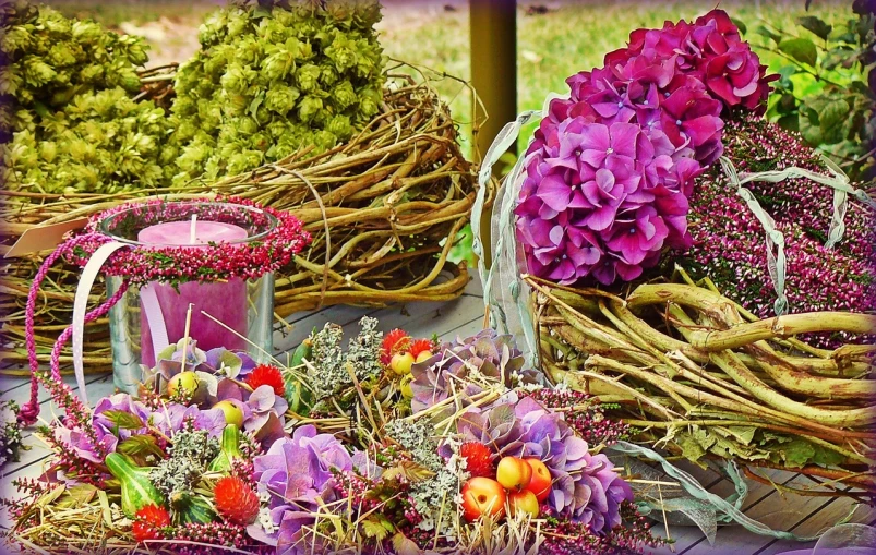 a bunch of flowers sitting on top of a table, a digital rendering, by Henryka Beyer, pexels, sukkot, moss and flowers, made of flowers and berries, purples