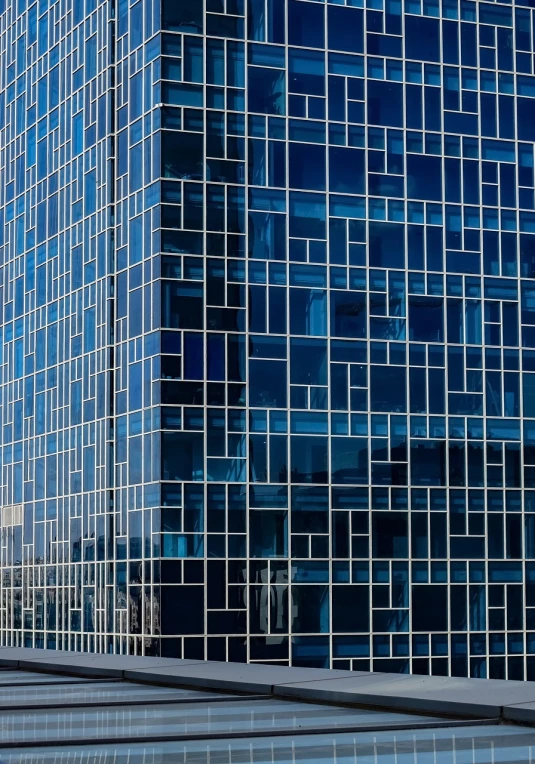 a red fire hydrant sitting in front of a tall building, a mosaic, by Andrei Kolkoutine, modernism, blue reflections, glass wall, shot on sony a 7 iii, shades of blue