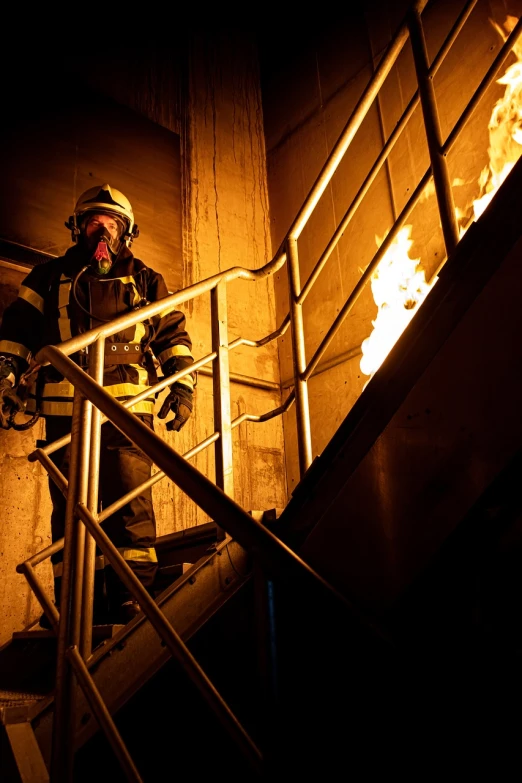 a firefighter standing at the top of a set of stairs, a photo, shutterstock, wearing tumultus flames, training, stock photo