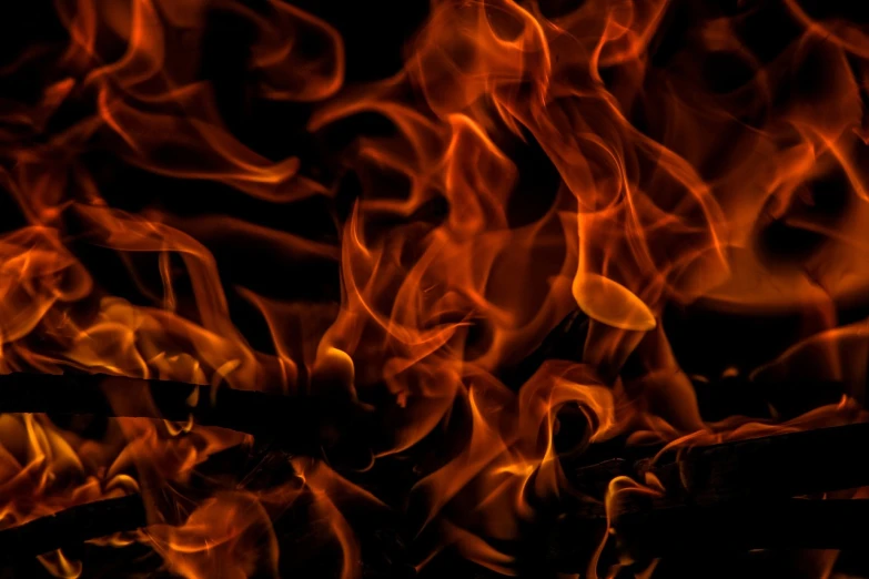a close up of a fire on a black background, a picture, by Rodney Joseph Burn, pexels, digital art, background image, avatar image, the pits of hell, iphone background