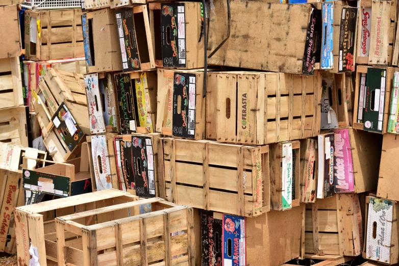 a bunch of wooden crates stacked on top of each other, by Richard Carline, flickr, assemblage, toronto, books cave, fruit, scrapyard architecture